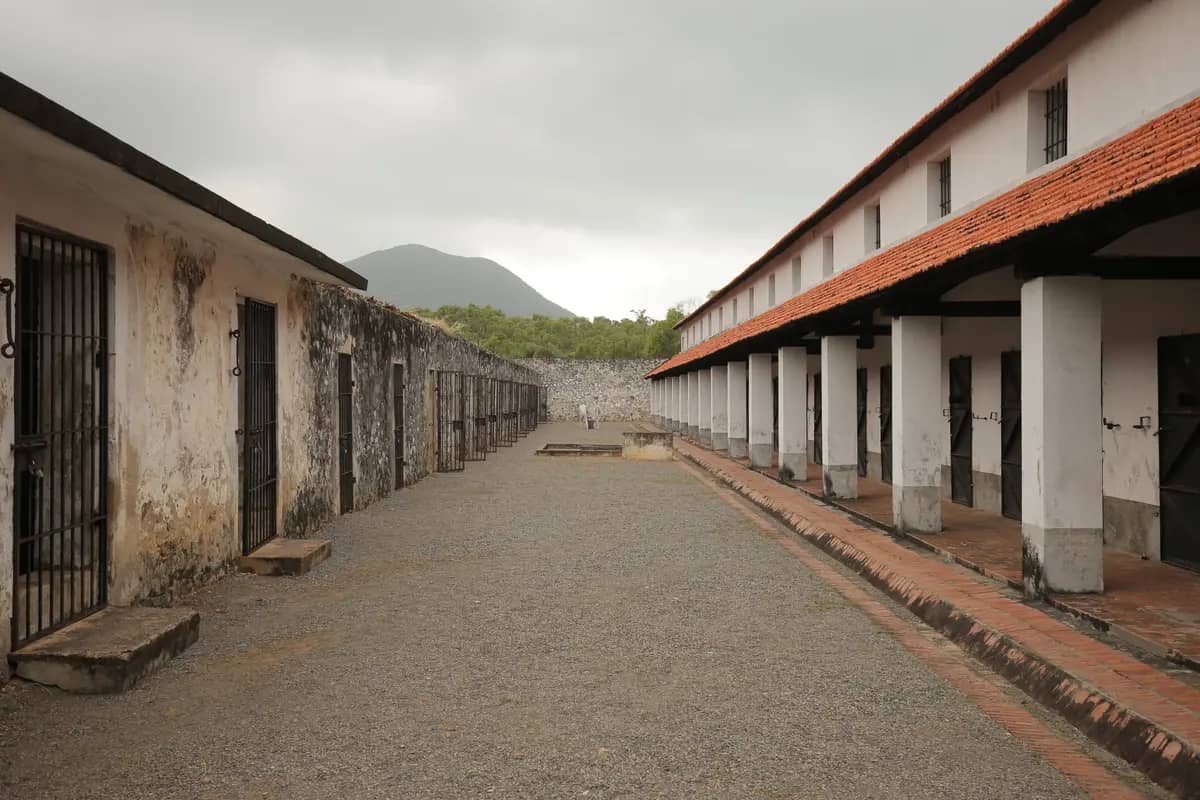 Long single storey cell blocks lining a courtyard at Con Dao Prison