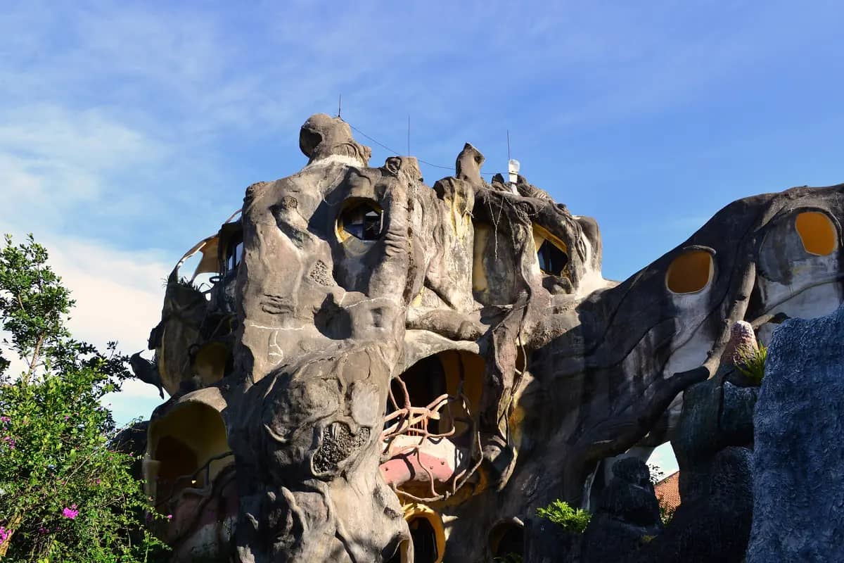 The twisting, tree-like concrete walls and round windows of the Crazy House in Da Lat