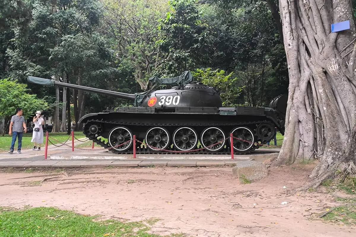 Tank No. 390 on display under the trees in the grounds of the Independence Palace