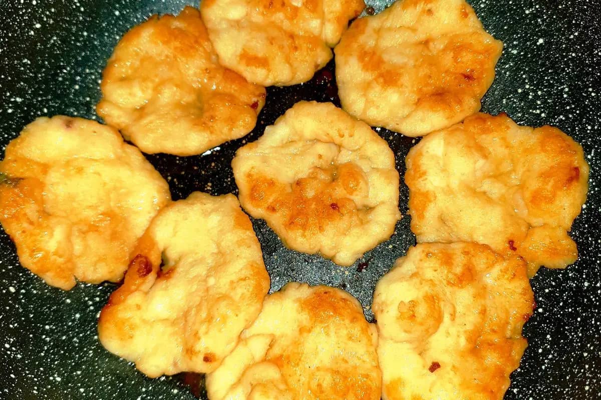 Cha muc, Quang Ninh squid cakes, turning golden in a frying pan