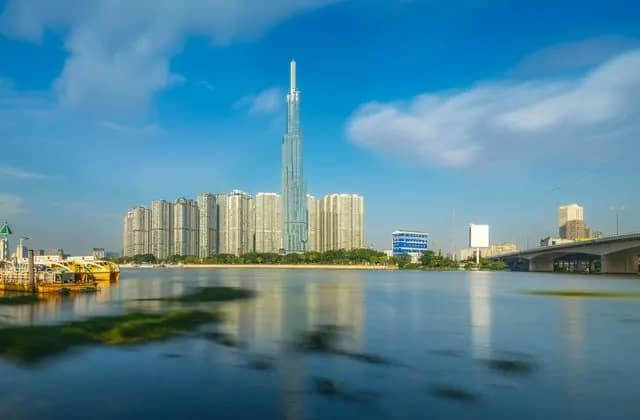 Landmark 81 and riverside towers across the Saigon River on a clear day