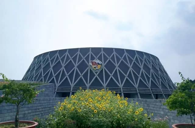 The Dien Bien Phu Victory Museum, its dome patterned like a soldier's camouflaged hat