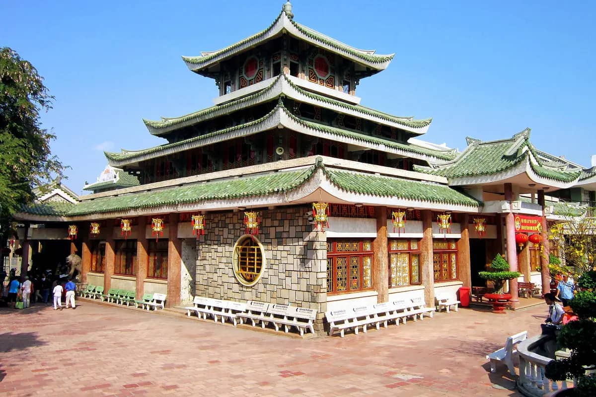 The green-tiled, three-tier roof of the Ba Chua Xu temple at the foot of Sam Mountain