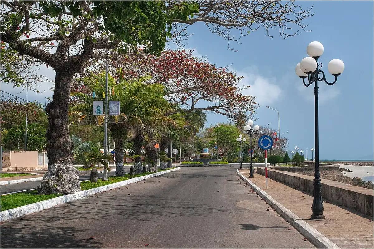 The seafront road in Con Son town, lamps along the sea wall