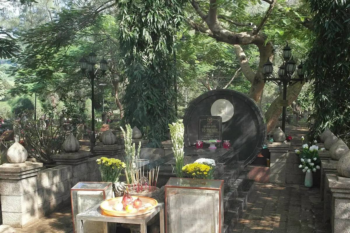 Flowers, incense and offerings at the grave of Vo Thi Sau in Hang Duong Cemetery