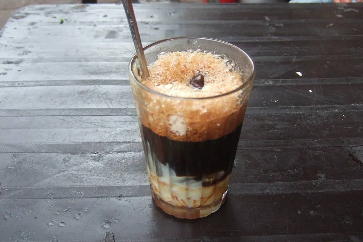 A glass of ca phe sua da, iced coffee with condensed milk