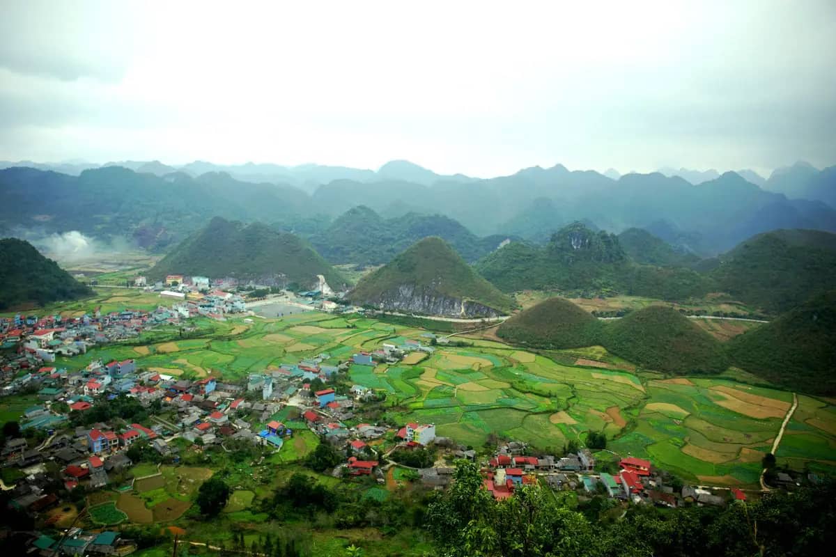 The view from Quan Ba Heaven Gate over Tam Son town, its rice fields and the rounded karst hills of the valley