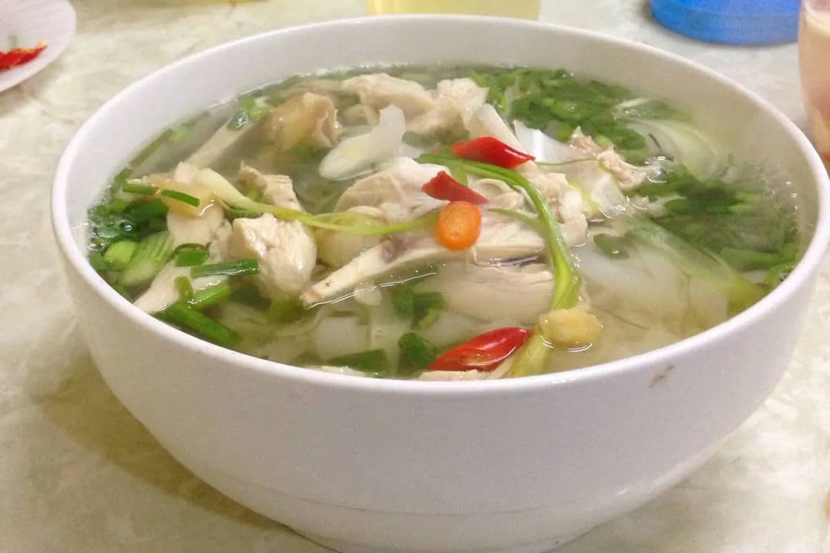 A bowl of chicken pho with spring onions and chilli, the kind served at Pho Ga Nguyet