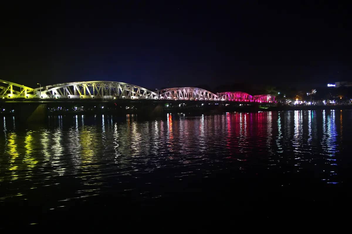 Truong Tien Bridge lit in changing colours and reflected in the Perfume River at night