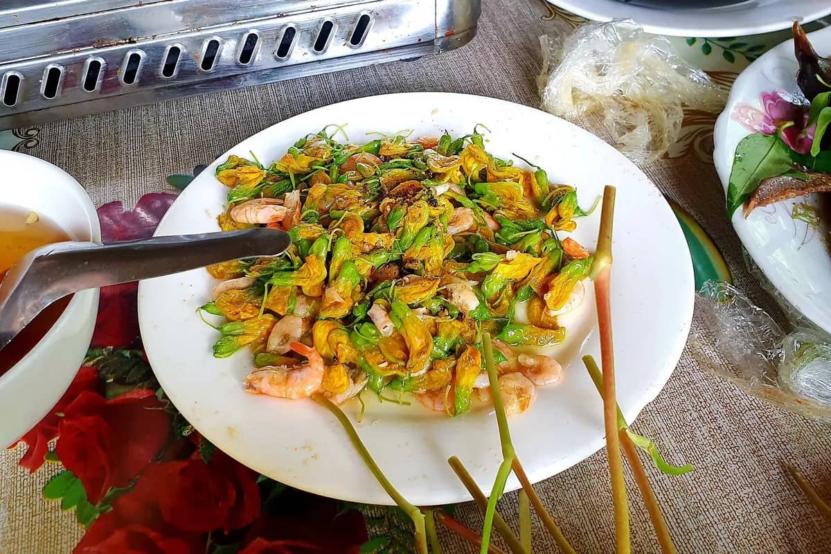 A plate of yellow dien dien flowers fried with shrimp at a lunch on Con Son islet