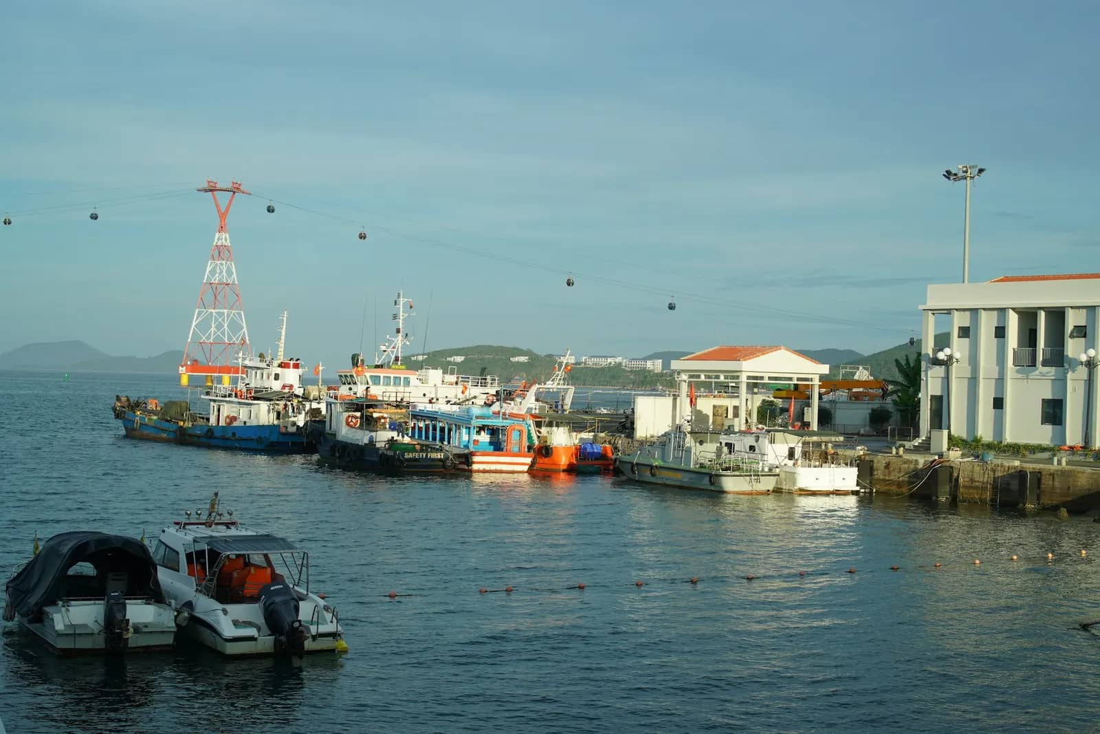 Boats at the harbour, a cable car tower behind