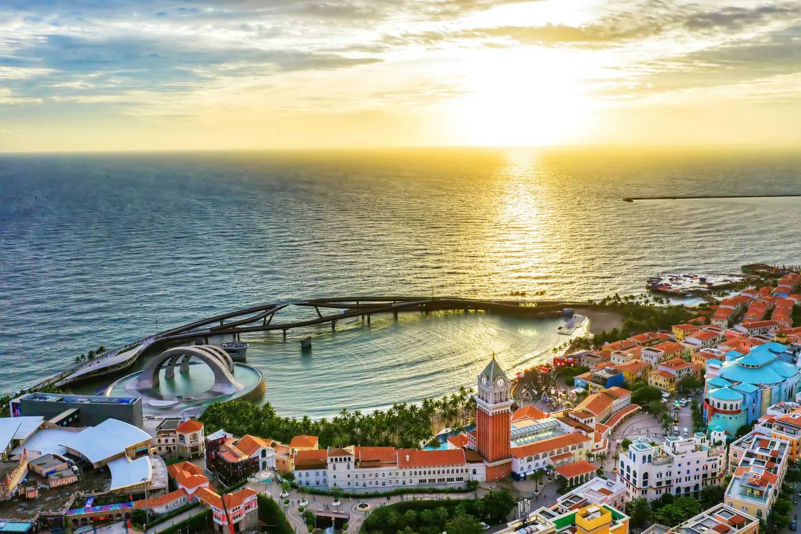 Sunset Town from above: the clock tower, the curved bridge and the sea