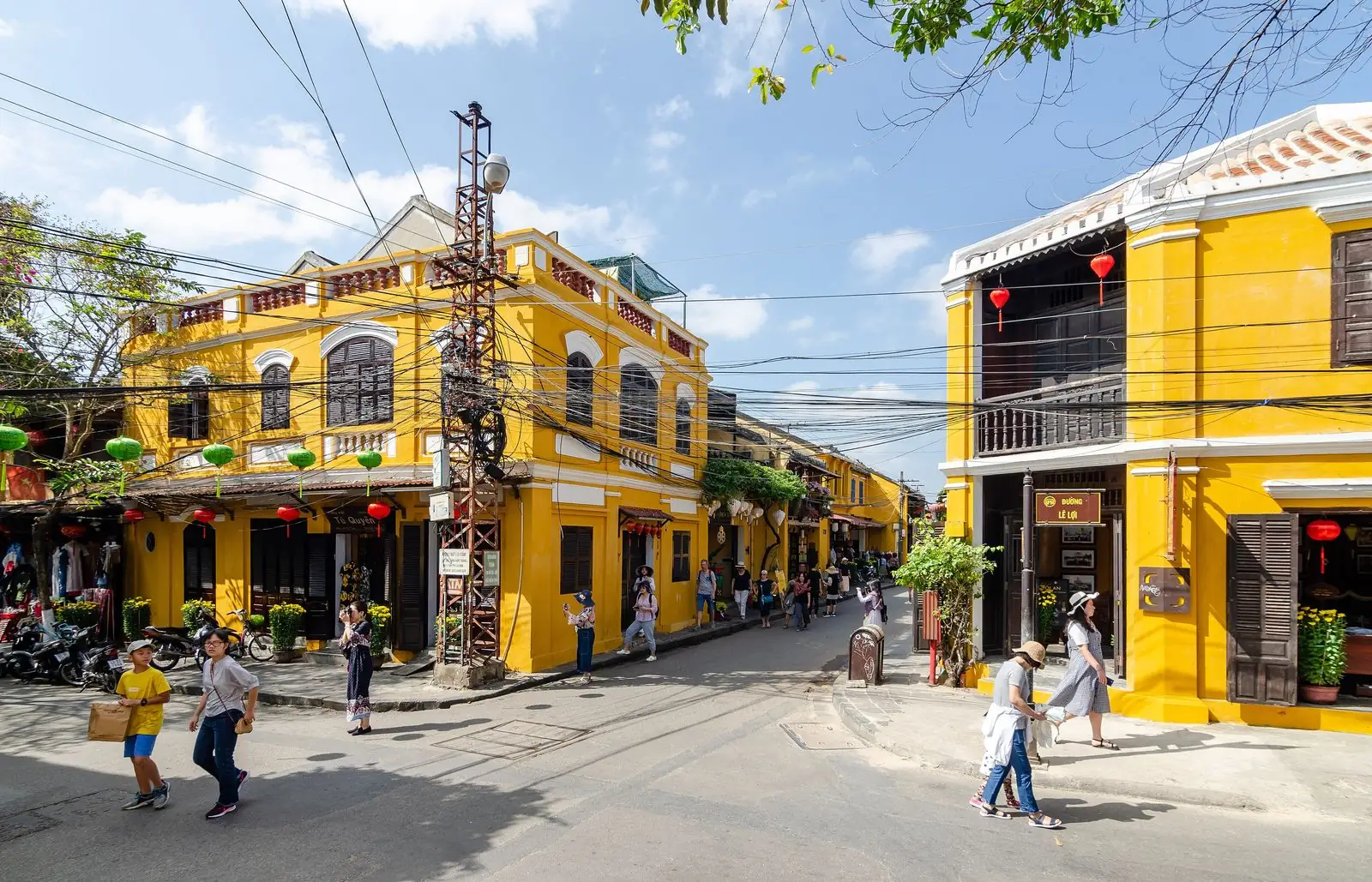 Yellow-walled houses on a street in the ancient town of Hoi An