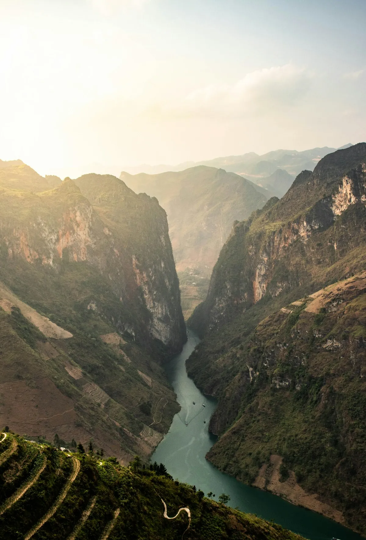 The Nho Que River in the Tu San canyon, a thin green ribbon between towering rock walls in Ha Giang
