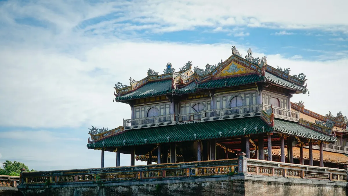 The Five Phoenix Pavilion with green and yellow tiled roofs on top of Ngo Mon, the Meridian Gate in Hue