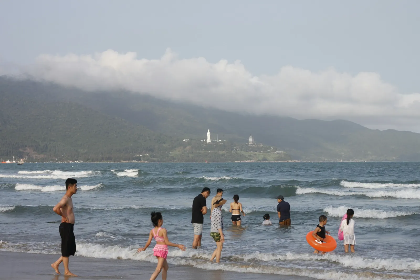 People on the beach on a cloudy day