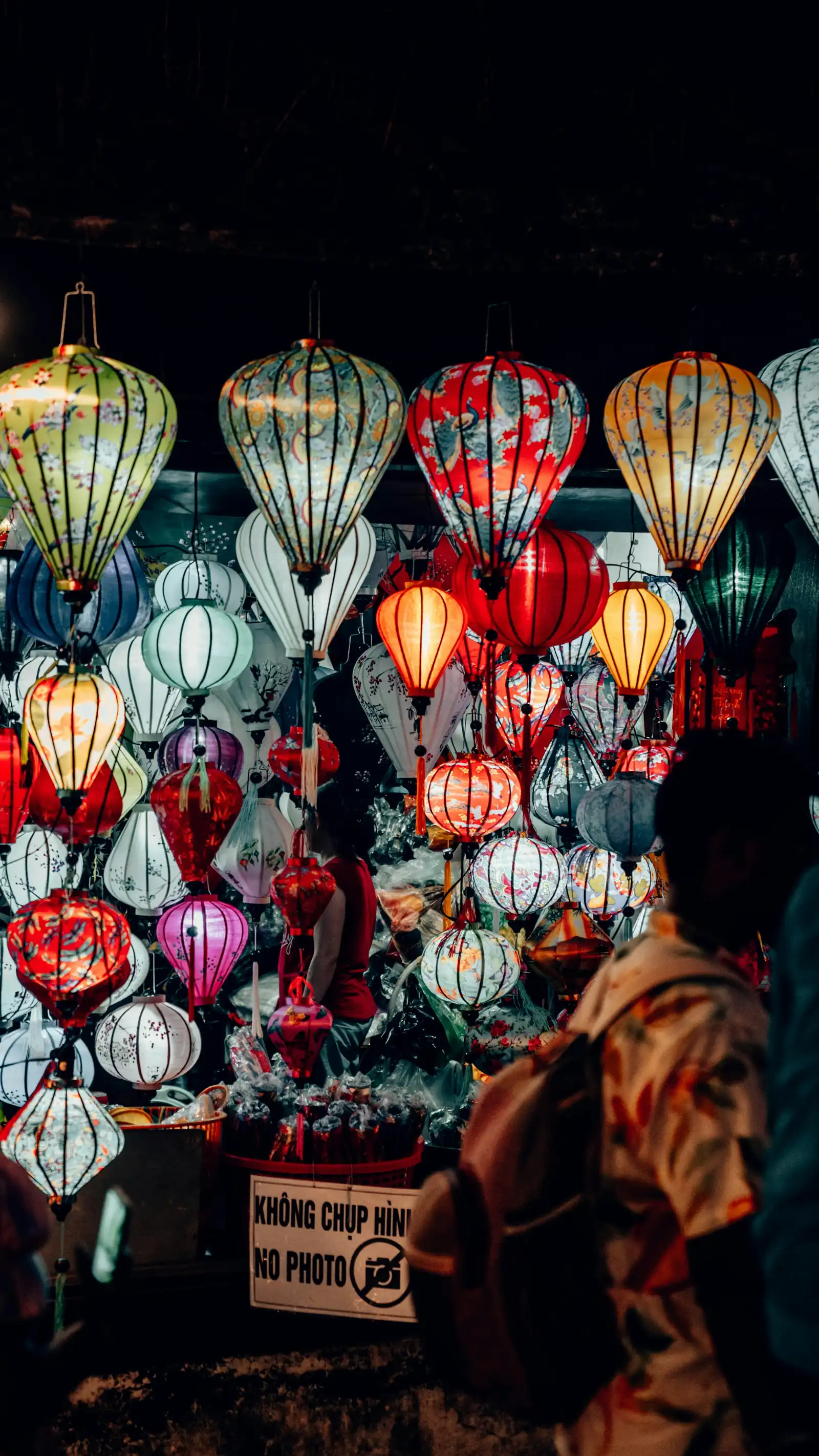 Silk lanterns of every colour hanging in a shop